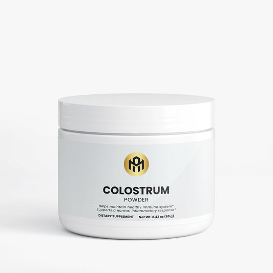 Jar of colostrum powder with a white background
