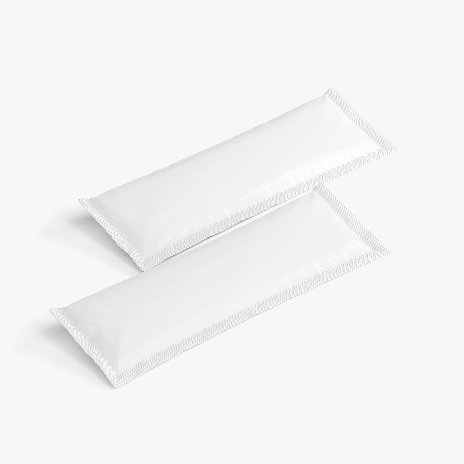 Two white sachets on a light gray background