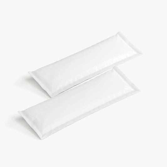 Two white sachets on a light gray background